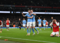 Arsenal lose 2-1 to Manchester City as title race tightens