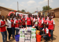 Arsenal supporters in Mzuzu donate K3 million cleaning gear after title parade