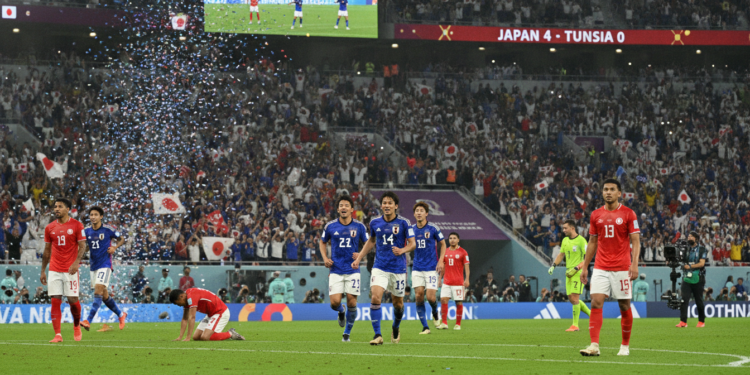Japan thrashes Tunisia 4-0 in World Cup 1,000th game, nears last 32